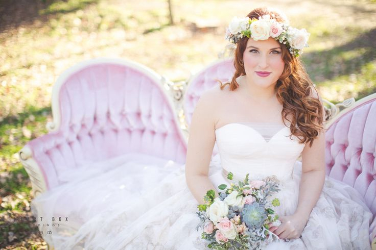 Photo by Heart Box Weddings - With a gorgeously tufted french loveseat as her main backdrop, her cocktail-style dress, and her sophisticated floral accents, this bride combines the best of the Victorian Era, the 1950s, and the modern bohemian movement with beauty and grace.